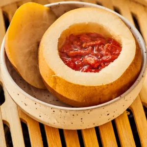 image of pear with berries in middle